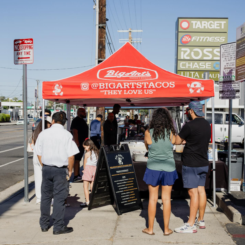 Big Art's taco stand with customers